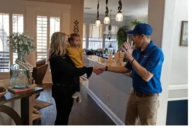 AdvantaClean worker helping a family