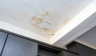 Water stains and damage on the ceiling.